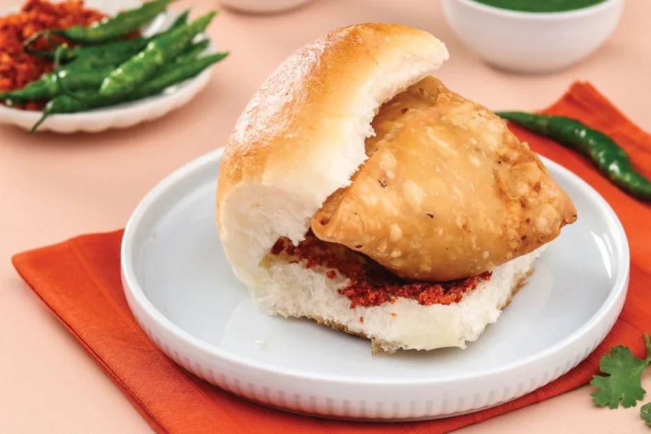Samosa pav at Sweet-Chili Authentic Indian Restaurant Edmonton - crispy samosa served in a soft pav bun with chutney
